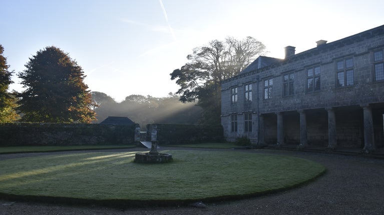 Godolphin house in morning light with view of the garden at Godolphin, Cornwall